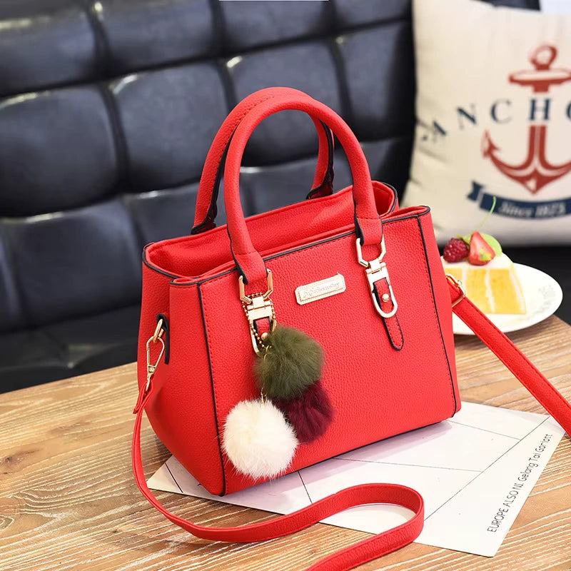 Stylish Leather Handbag with Pendant